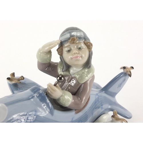 2363 - Lladro mode of a boy in a plane, 5697, 19cm in length