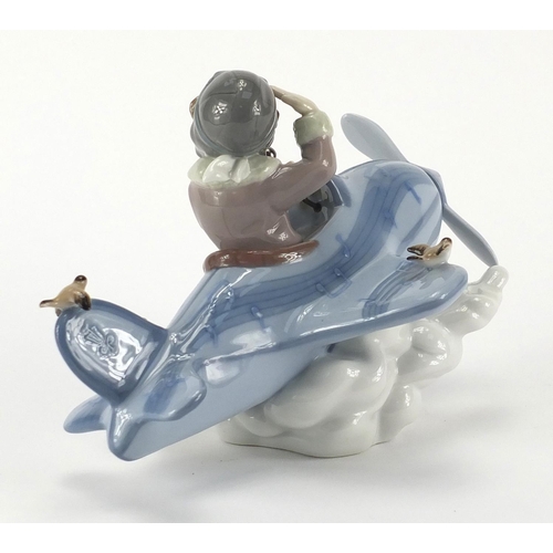 2363 - Lladro mode of a boy in a plane, 5697, 19cm in length