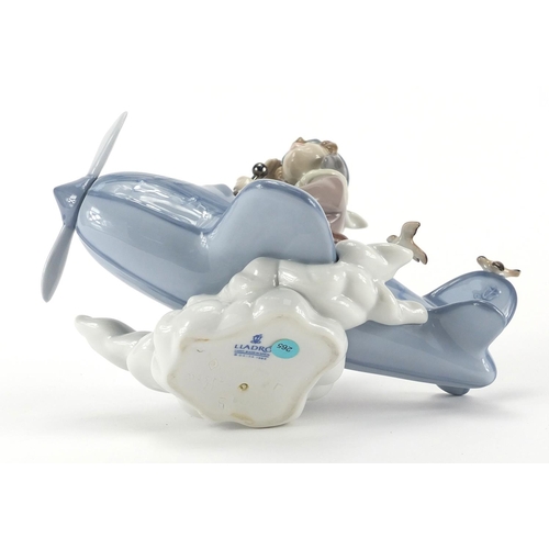 2363 - Lladro mode of a boy in a plane, 5697, 19cm in length