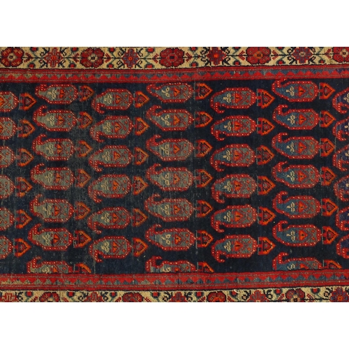 2055 - Rectangular Persian Hamadan carpet runner, having an all over stylised design within meandering flor... 