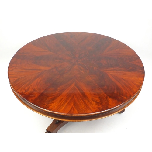 2012 - Victorian mahogany circular breakfast table, the flamed veneered top above a triangular column on sc... 