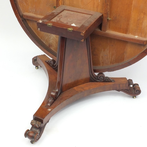 2012 - Victorian mahogany circular breakfast table, the flamed veneered top above a triangular column on sc... 