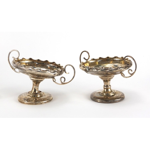 2423 - Silver items comprising a pair of pedestal dishes, pair of cut glass vases and a pair of cut glass o... 