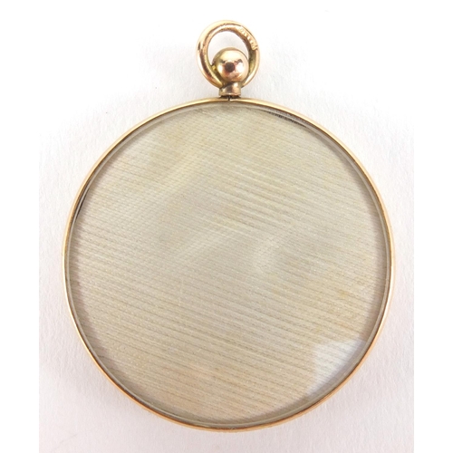 2632 - Circular 9ct gold mourning locket housing a portrait miniature of a young child, 3.2cm in diameter