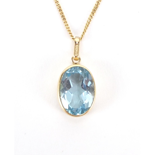 2557 - 9ct gold blue topaz pendant on a 9ct gold necklace, the pendant 2.5cm in length, approximate weight ... 