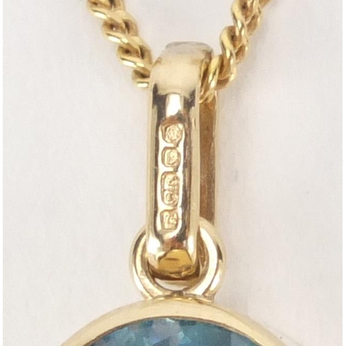 2557 - 9ct gold blue topaz pendant on a 9ct gold necklace, the pendant 2.5cm in length, approximate weight ... 