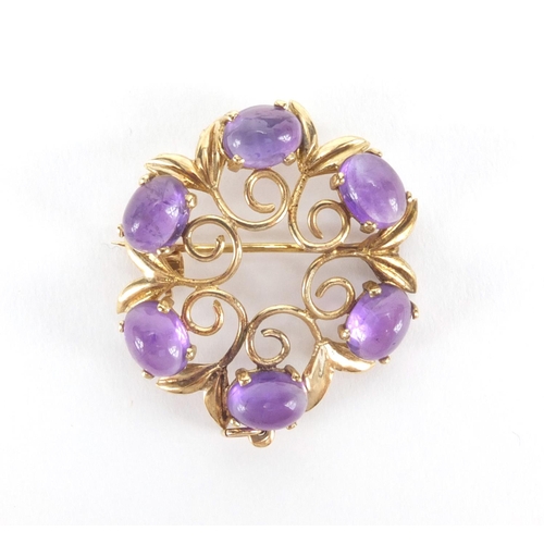 2554 - 9ct gold cabochon amethyst brooch, 3cm in diameter, approximate weight 5.4g