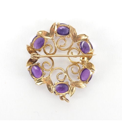 2554 - 9ct gold cabochon amethyst brooch, 3cm in diameter, approximate weight 5.4g