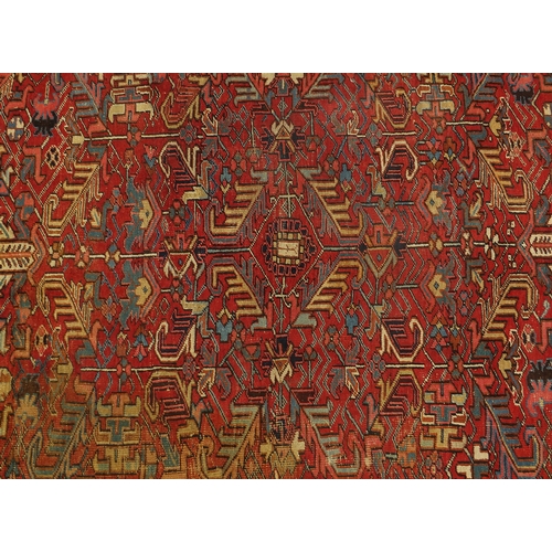 2025 - Persian Heriz carpet having an all over floral design, 322cm x 235cm