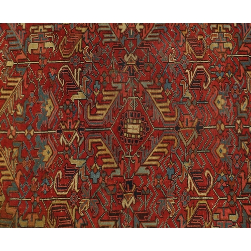 2025 - Persian Heriz carpet having an all over floral design, 322cm x 235cm