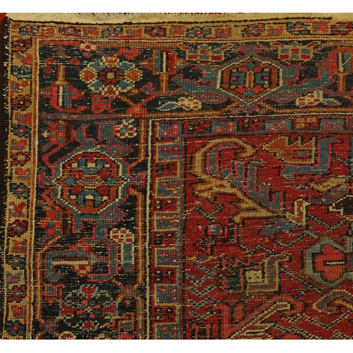 2025 - Persian Heriz carpet having an all over floral design, 322cm x 235cm