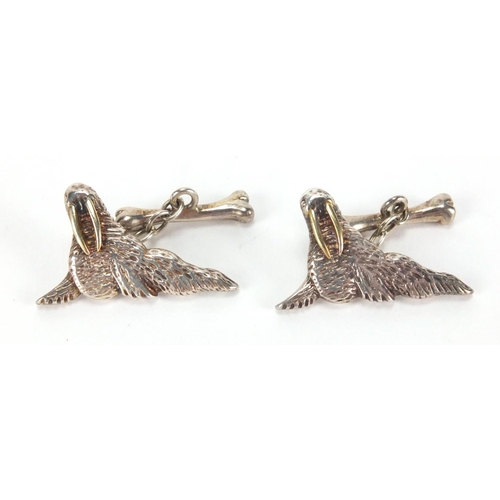 2651 - Pair of Irish silver walrus cuff links, originally retailed by David Morris