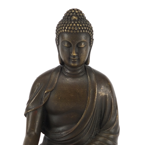 2393 - Chinese bronzed figure of a Buddha seated in the Lotus position, 17cm high