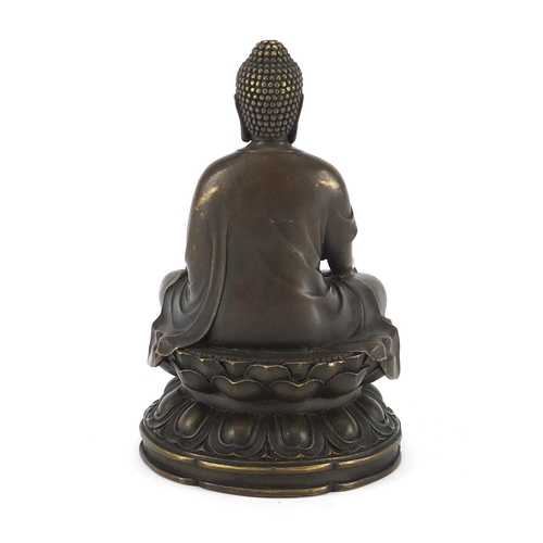 2393 - Chinese bronzed figure of a Buddha seated in the Lotus position, 17cm high