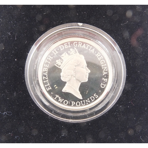 2457 - Two silver proof Piedfort two pound coins together with a 2001 Britannia one ounce silver two pound