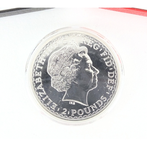 2457 - Two silver proof Piedfort two pound coins together with a 2001 Britannia one ounce silver two pound