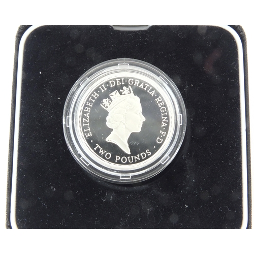 2457 - Two silver proof Piedfort two pound coins together with a 2001 Britannia one ounce silver two pound