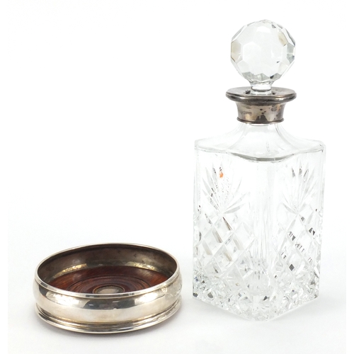 2420 - 2000 Millennium silver wine coaster together with a glass decanter with silver collar, the decanter ... 