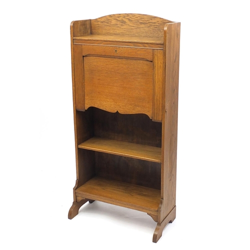 4 - Oak Arts & Crafts students bureau with a fall enclosing a fitted interior, 120cm high
