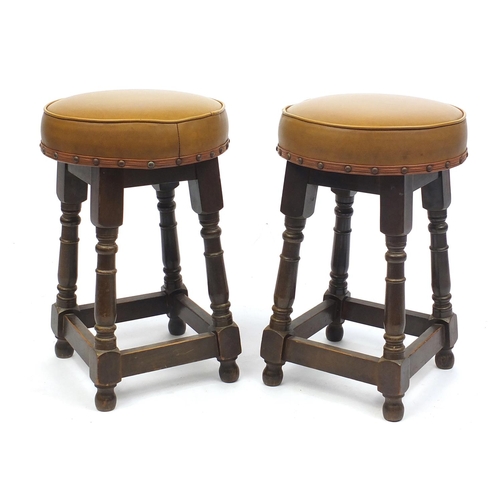 48 - Pair of oak stools with circular tan leather seats