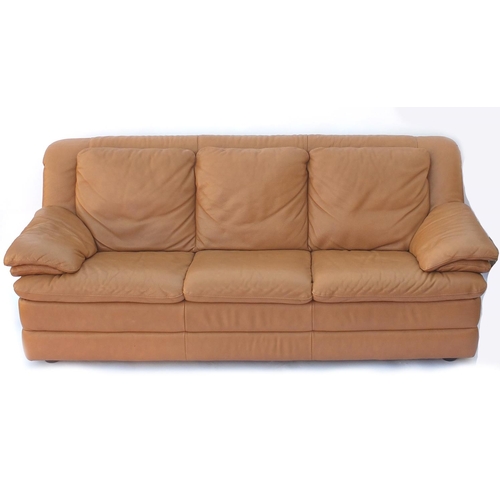 40 - Natuzzi brown leather three seater settee, 220cm in length