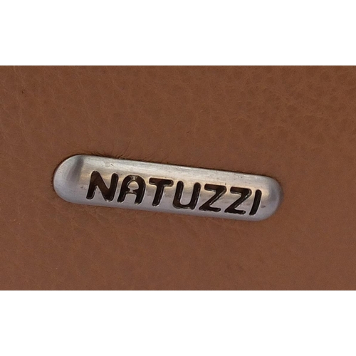 40 - Natuzzi brown leather three seater settee, 220cm in length