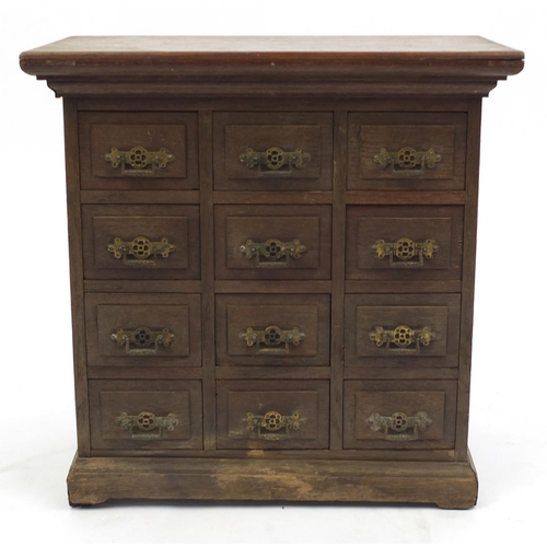 32 - Oak table top specimen chest fitted with twelve drawers, all with brass handles, 46cm H x 46cm W x 2... 