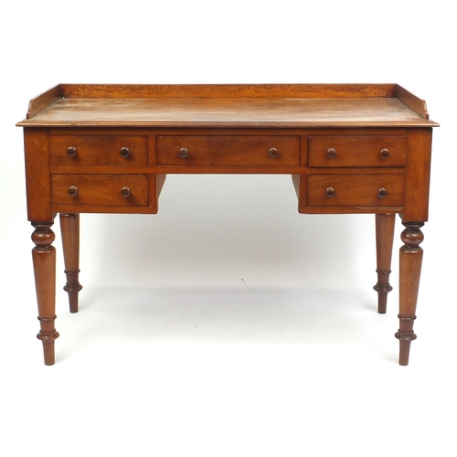 1 - Victorian mahogany dressing table/desk with galleried top above an arrangement of five drawers on tu... 