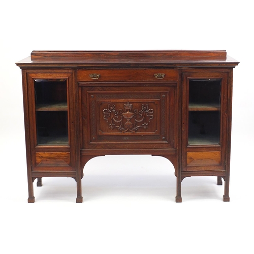 1 - Victorian rosewood side cabinet, the central panelled door carved with an urn, 107cm H x 153cm W x 4... 