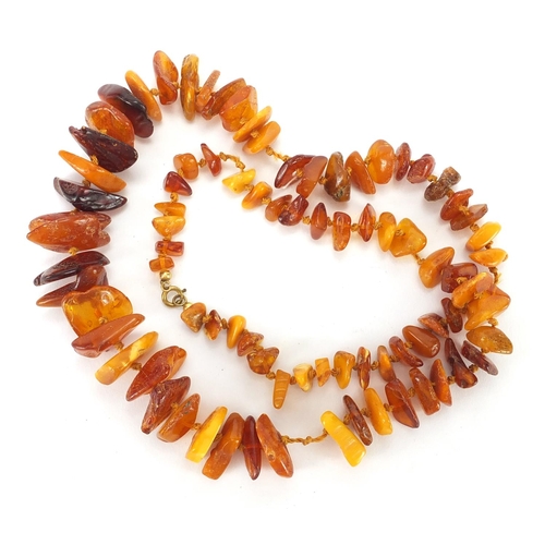 909 - Natural amber section necklace, 70cm in length, approximate weight 52.0g