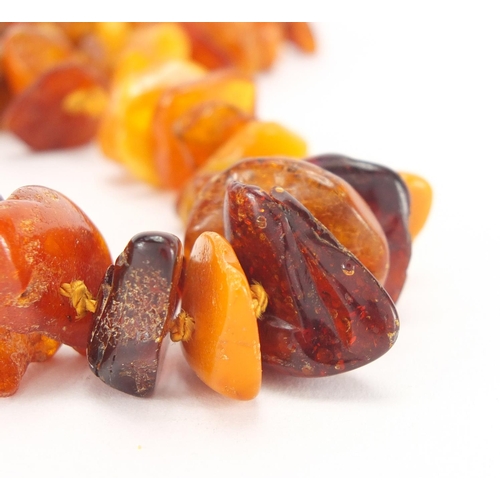 909 - Natural amber section necklace, 70cm in length, approximate weight 52.0g