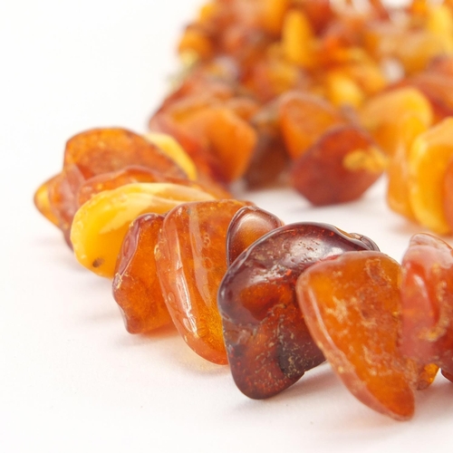 909 - Natural amber section necklace, 70cm in length, approximate weight 52.0g