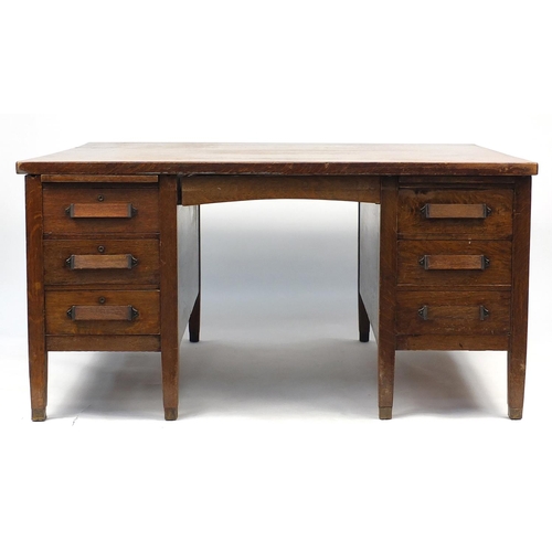 6 - Oak partners desk fitted with a series of drawers, 77cm H x 153cm W x 122cm D