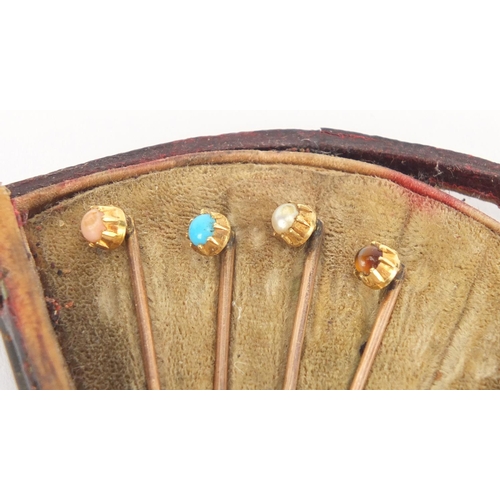 892 - Group of gold coloured metal tie pins set with assorted stones including coral, turquoise, pearl and... 