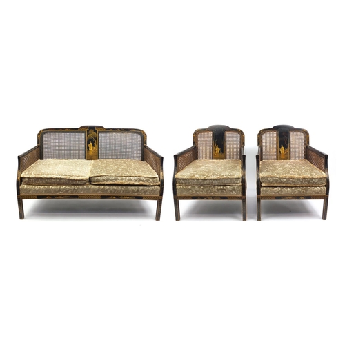 2023 - Black lacquered three piece Bergere suite hand painted in the chinoiserié manor, the end panels bein... 