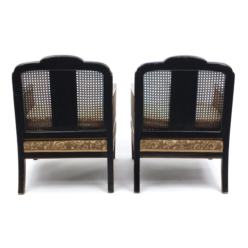 2023 - Black lacquered three piece Bergere suite hand painted in the chinoiserié manor, the end panels bein... 