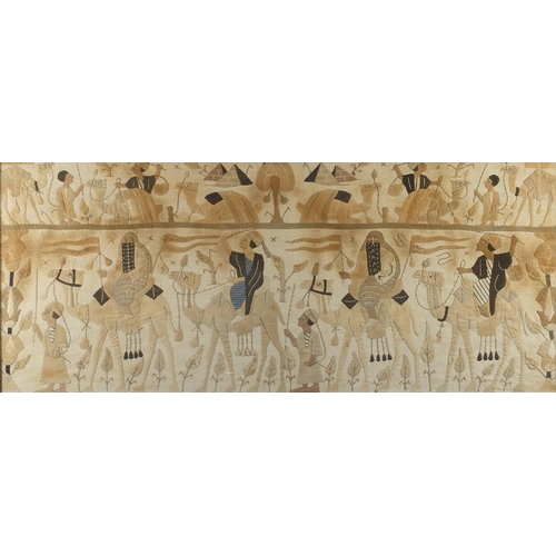 579 - Middle Eastern cloth panel embroidered with figures on camel backs, framed, 101cm x 42cm