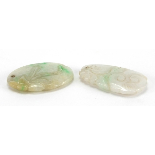 492 - Two Chinese carved green and white jade pendants, the largest 4cm high