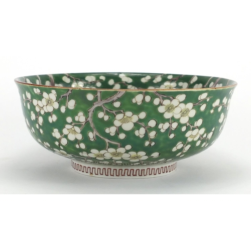 422 - Chinese porcelain bowl hand painted with Prunus flowers onto a green ground, character marks to the ... 