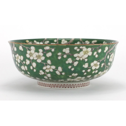 422 - Chinese porcelain bowl hand painted with Prunus flowers onto a green ground, character marks to the ... 