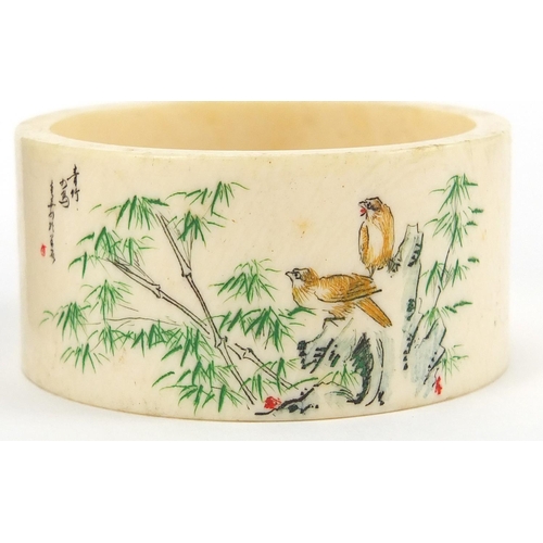 517 - Pair of Chinese ivory napkin rings together with a cloisonné matchbox holder, the napkin rings hand ... 