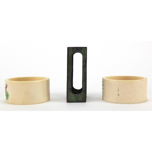 517 - Pair of Chinese ivory napkin rings together with a cloisonné matchbox holder, the napkin rings hand ... 