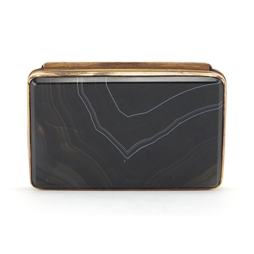 4 - Gilt metal hard stone snuff box, the hinged lid having a checked design, 2cm H x 7.5cm W x 4.5cm D