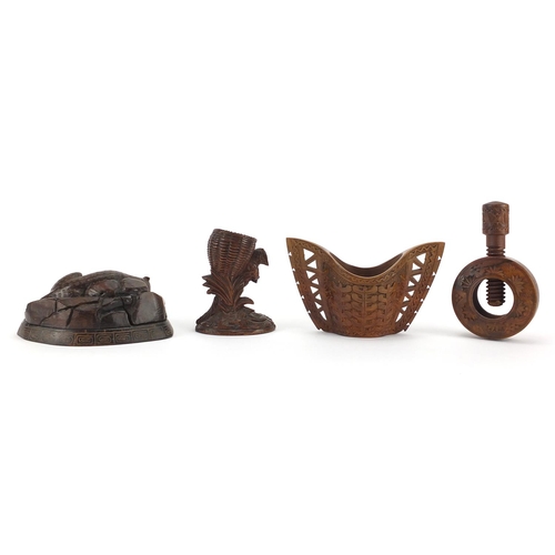 96 - Treen objects including a carved black forest carved squirrel egg cup, Scandinavian twin handled cup... 