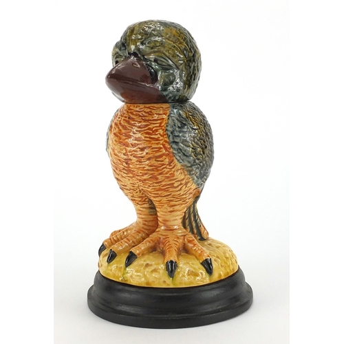 664 - Wally bird pottery tobacco Jar and cover on a wooden  base, overall 24cm high