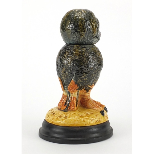 664 - Wally bird pottery tobacco Jar and cover on a wooden  base, overall 24cm high