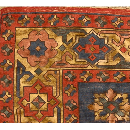 2005 - Rectangular Turkish rug having an all over geometric floral design with corresponding boarders, 300c... 
