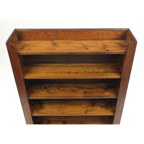 38 - Stained pine five shelf open bookcase, 118cm high