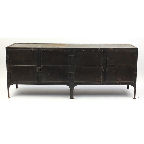 2026 - Industrial metal side cabinet with four riveted panelled doors, 77cm H x 193cm W x 51cm D