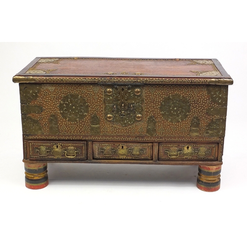 2009 - Colonial hardwood dowry chest with tooled brass plates and stud work, fitted with three drawers on t... 